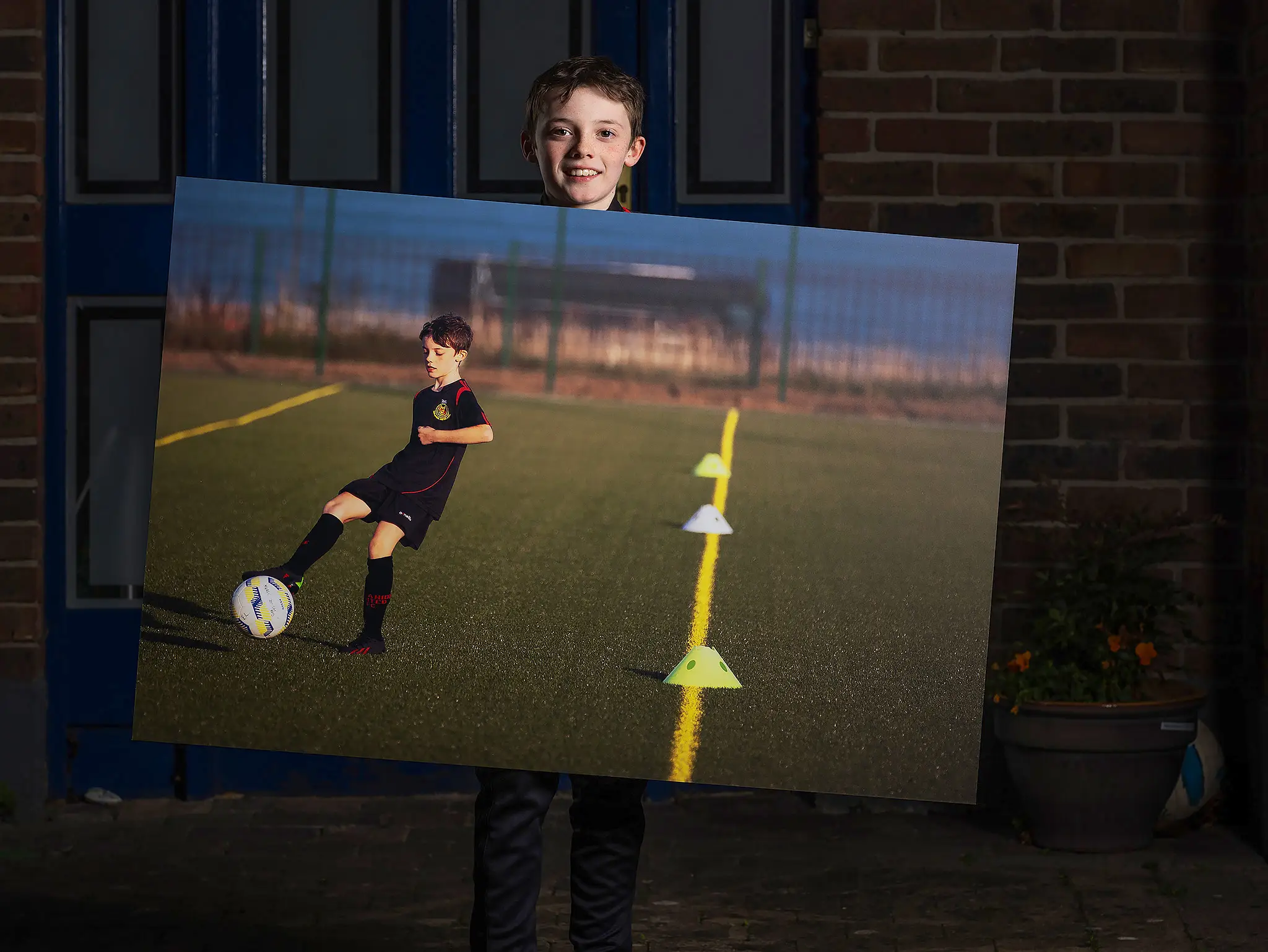 Happy child with wall art