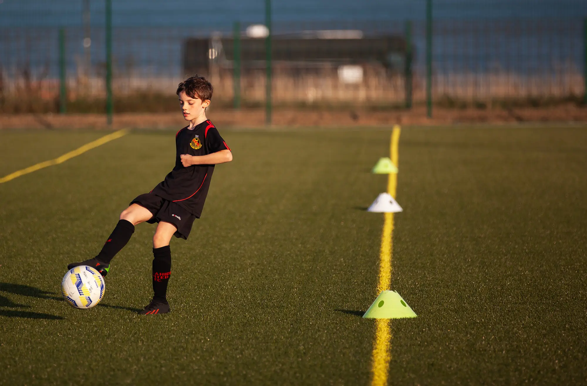 Boy playing football AFC